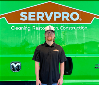 tech in front of Servpro van