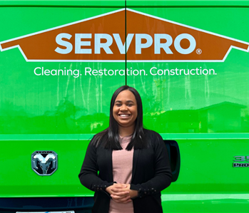 Woman in front of Servpro Sign