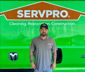 tech in front of Servpro van