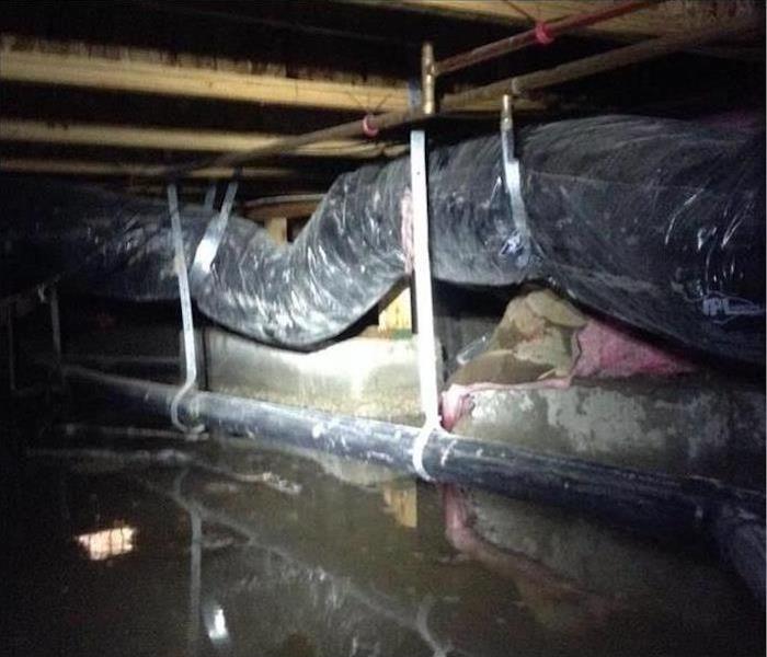 muddy water in a crawl space