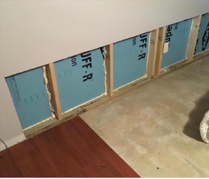 cut out wallboard and exposed pad, no planks