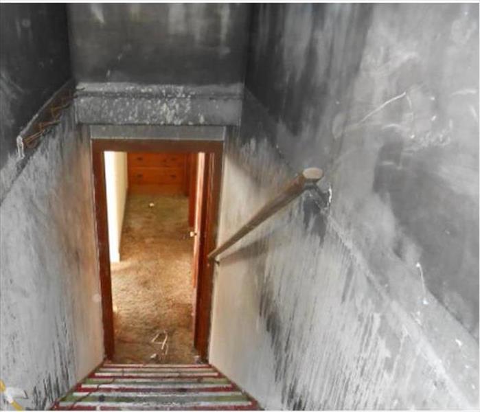 sooty deposits in stairwell, black